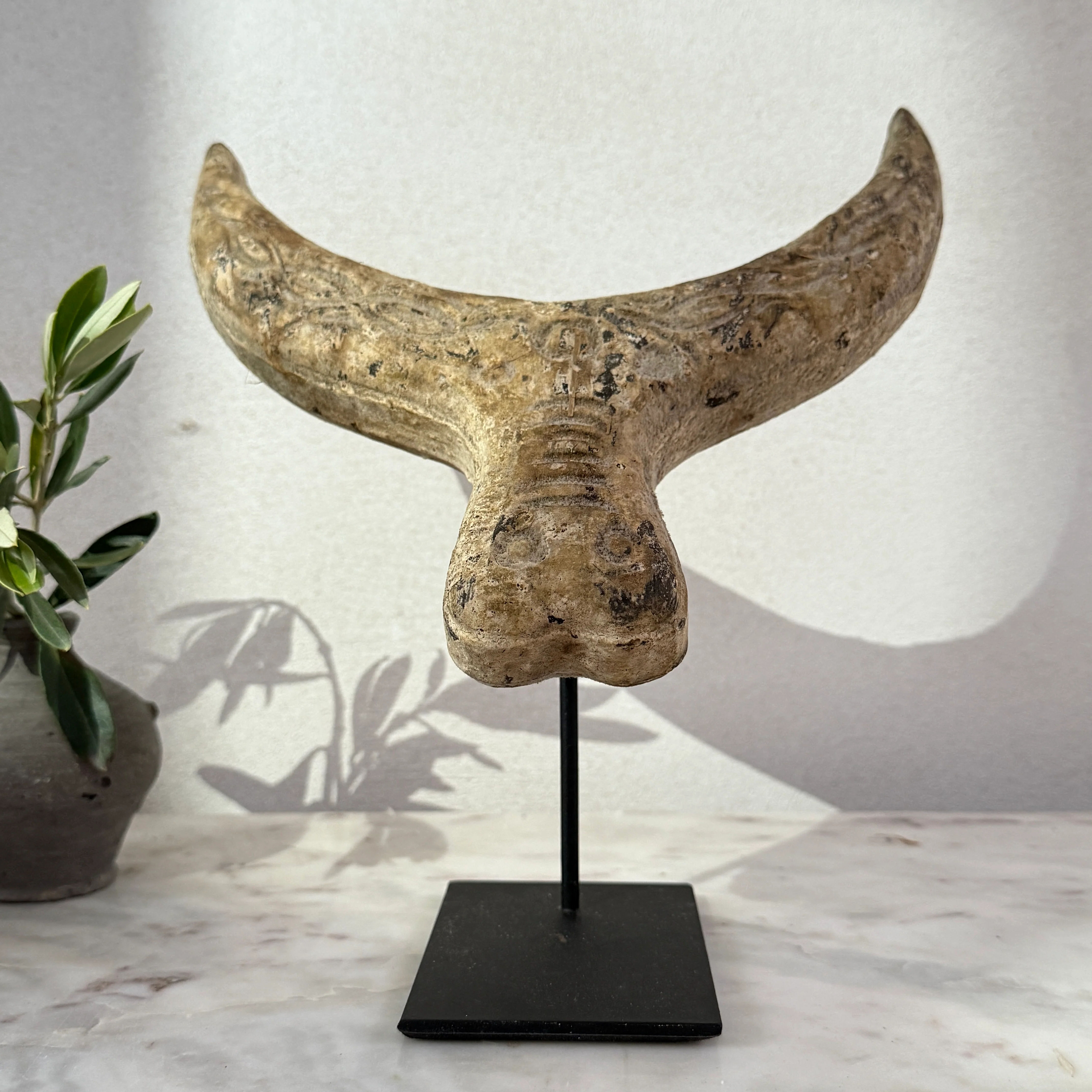 Primitive wooden cow horn sculpture
